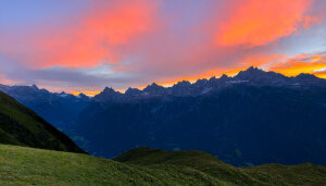 Sunrise over a mountain range in the alpes